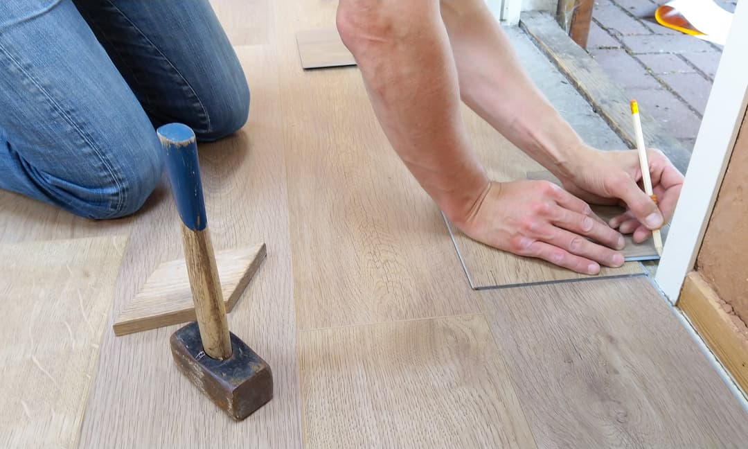 Person installing flooring